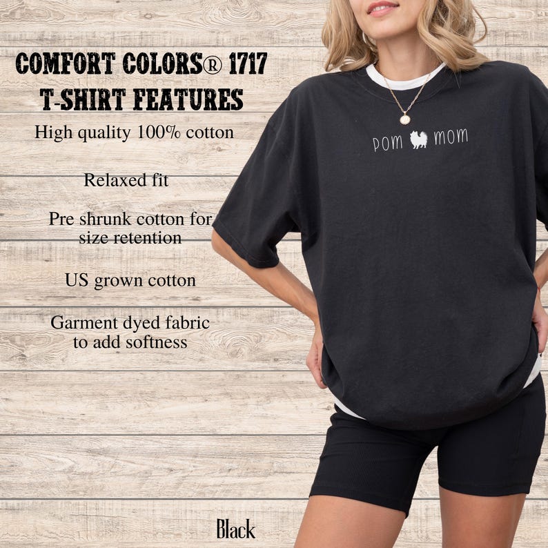 May include: Black Comfort Colors T-shirt with "POM mom" text. The shirt features a relaxed fit and is made of high-quality, garment-dyed 100% cotton. The shirt has pre-shrunk cotton for size retention and is made with US-grown cotton.