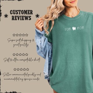 May include: A teal long-sleeve shirt with the text "POM MOM" and a Pomeranian dog illustration. The shirt is part of a customer reviews display, with text about shipping and comfort.