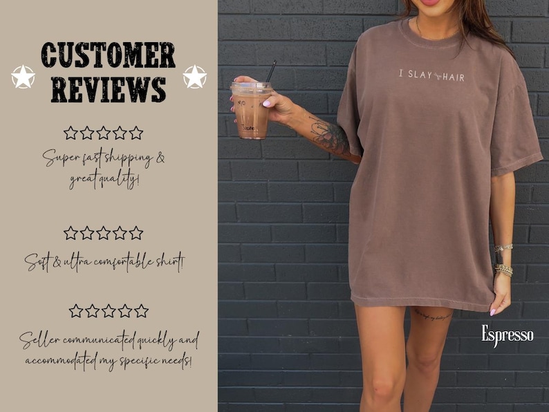 May include: A brown oversized t-shirt with the text "I SLAY HAIR" printed on the front. The shirt is being modeled by a person with a tattoo on their arm. The background is a brick wall.