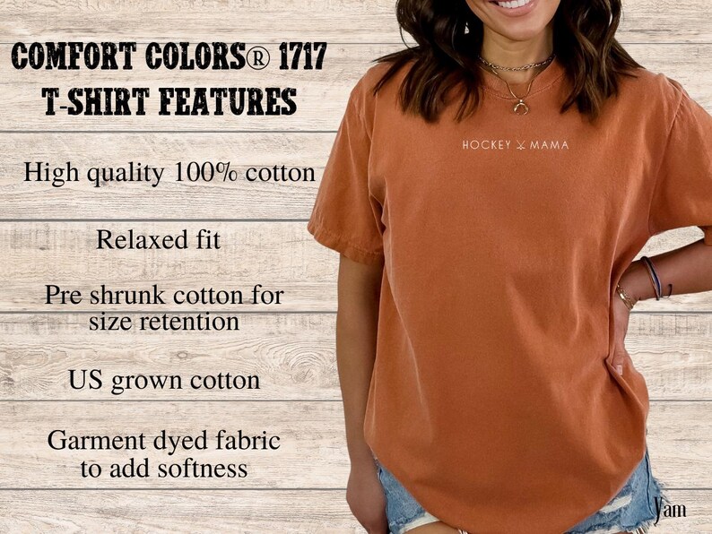 May include: A rust-colored t-shirt with the text "HOCKEY MAMA" printed on the front. The t-shirt is made of 100% cotton and has a relaxed fit.