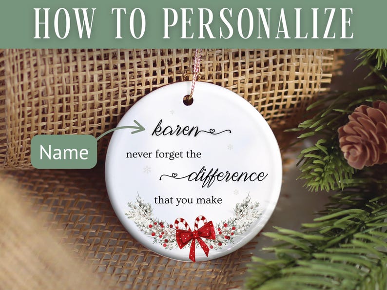 May include: A white ceramic ornament with a gold string for hanging. The ornament has the text "Karen, never forget the difference that you make." A red bow and candy canes decorate the bottom. The background includes a Christmas tree and burlap.