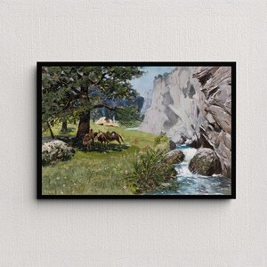 May include: Framed landscape painting depicting a serene outdoor scene. The artwork features a river flowing through a valley, with a large tree and figures on horseback. The color palette includes greens, blues, and browns.