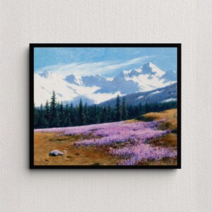 May include: A framed landscape painting depicts a mountain range with snow-capped peaks under a blue sky. A field of purple flowers and a dark green forest are in the foreground. The painting is in a black frame.
