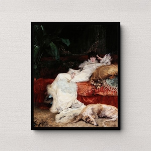 May include: A framed print of a classical painting. A woman in a white dress with fur trim reclines on a red velvet chaise lounge. A dog rests at her feet. The background is dark with a hint of foliage.
