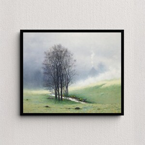 May include: A framed landscape painting depicts a serene scene with a stream winding through a grassy meadow. Bare trees stand in the foreground, with a misty mountain in the background. The artwork is framed in a black border.