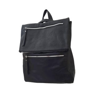 May include: Black backpack with a flap-over top and two zippered pockets. The backpack has a top handle and adjustable straps. The zippers are silver-toned. The material appears to be faux leather.