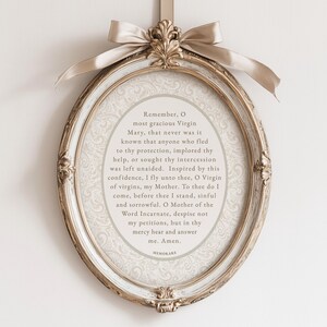 Memorare Prayer printable displayed in an ornate oval gold frame with ribbon bow — elegant Catholic digital download wall art inspired by traditional Marian devotion and vintage design.