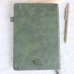Back view of sage green vegan leather Catholic journal with ribbon bookmarks and pen loop, elegant prayer notebook gift for women