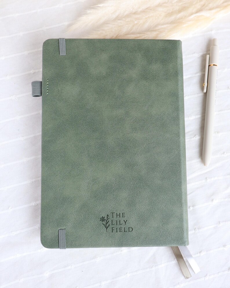 Back view of sage green vegan leather Catholic journal with ribbon bookmarks and pen loop, elegant prayer notebook gift for women