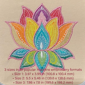 May include: A vibrant lotus flower embroidery design featuring petals in orange, yellow, blue, and pink. The design includes the text "3 sizes in 10 popular machine embroidery formats" with size details in inches and millimeters.