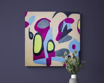 May include: A colorful abstract painting with pink, blue, yellow, and gray shapes on a beige background. The painting is hanging on a dark purple wall above a light blue dresser with six drawers.