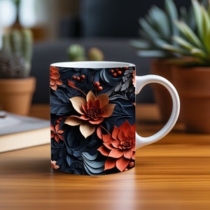 Peut inclure: Une tasse en céramique blanche avec un motif floral. Le motif présente un fond bleu foncé avec des fleurs orange et dorées.