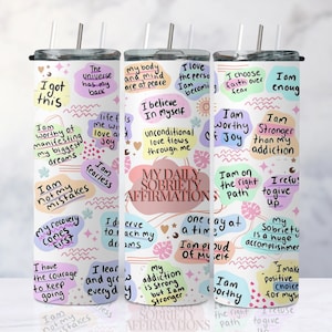 May include: Set of three white tumblers with colorful, abstract designs and motivational text. The text includes phrases like "I got this", "I am worthy of joy", and "My daily sobriety affirmations".