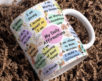 May include: White ceramic mug with a colourful design featuring positive affirmations. The text on the mug includes "My Daily Affirmations", "I am Strong", "I am Worthy of my Dreams", "I am Enough", and more.