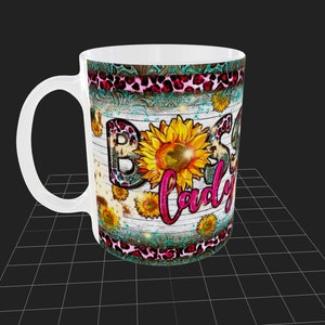 May include: White ceramic mug with a design featuring a pink and black leopard print, turquoise and white floral patterns, and sunflowers. The text "Boss Lady" is written in pink and white letters.