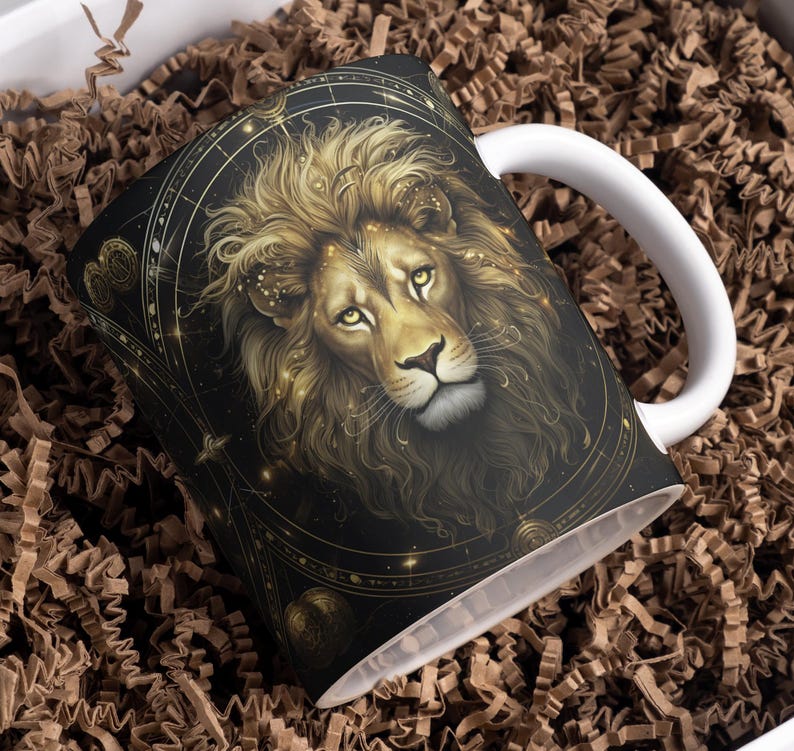 May include: White ceramic mug with a black and gold design featuring a lion's head with a celestial background.