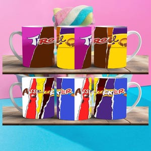 May include: Six white ceramic mugs with different designs. The mugs have a handle on the left side. The designs include a yellow, purple, and brown color scheme with the word "TROLL" and a chocolate bar design. The other mugs have a red, yellow, purple, and blue color scheme with the word "ARSE LICKER" and a chocolate bar design.