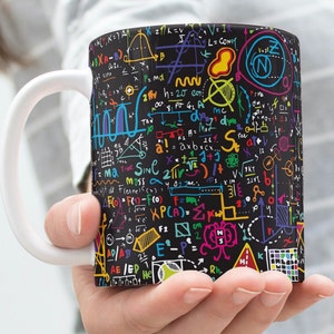 May include: A white ceramic mug with a black background and colourful mathematical equations and symbols. The mug has a large handle.
