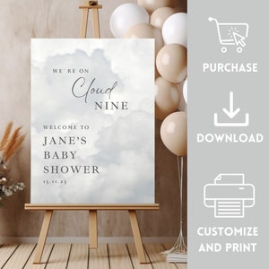 May include: A printable baby shower sign with a watercolor background of clouds. The text reads "We're on Cloud Nine. Welcome to Jane's Baby Shower 15.11.23"