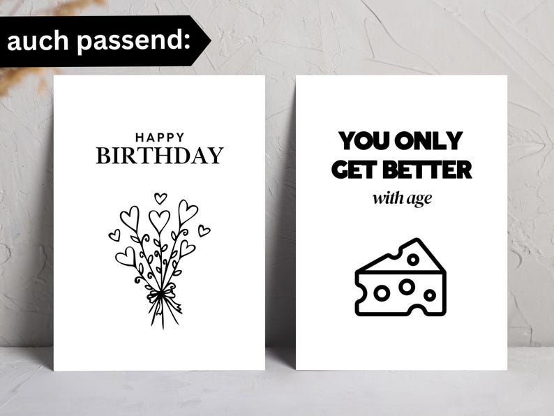 Op de afbeelding: Twee witte wenskaarten. De linkerkaart zegt "Happy Birthday" met een bloemenboeket van harten. De rechterkaart zegt "You Only Get Better with Age" met een illustratie van een kaas.