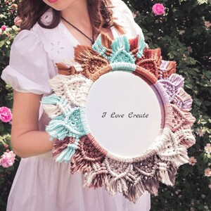May include: A white circular macrame wall hanging with a white background and the text "I Love Create". The macrame is made with brown, white, light blue, and purple yarn.