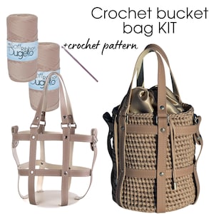 May include: Crochet bucket bag kit with two skeins of beige yarn, a crochet hook, and a finished beige crocheted bag with leather straps and accents.  The kit includes a crochet pattern.