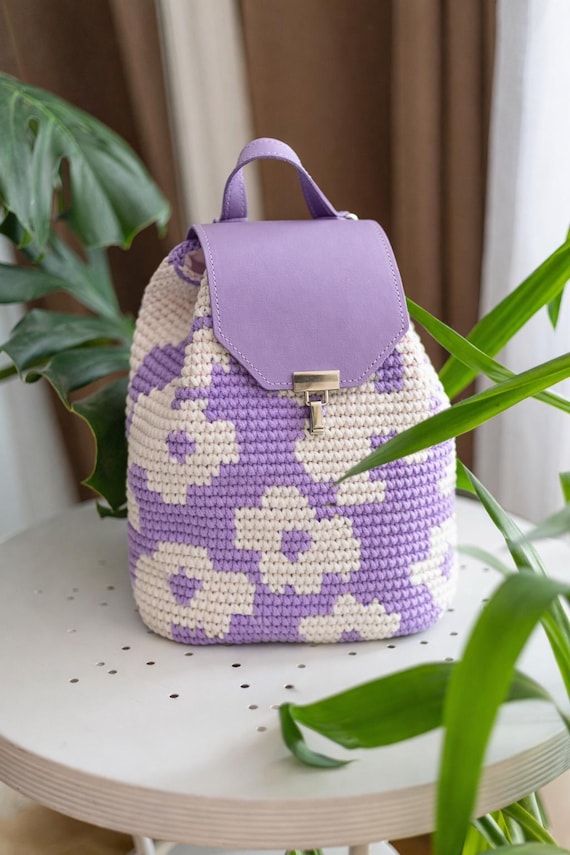 brown faux leather backpack with ivory floral crochet overlay Cara  Riley House Crafts With a main drawstring and snap closure Crochet Flower Backpack Pattern |