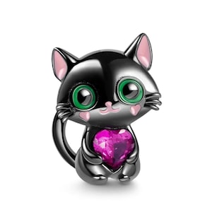 May include: Black cat charm with pink ears and green eyes holding a pink heart charm.