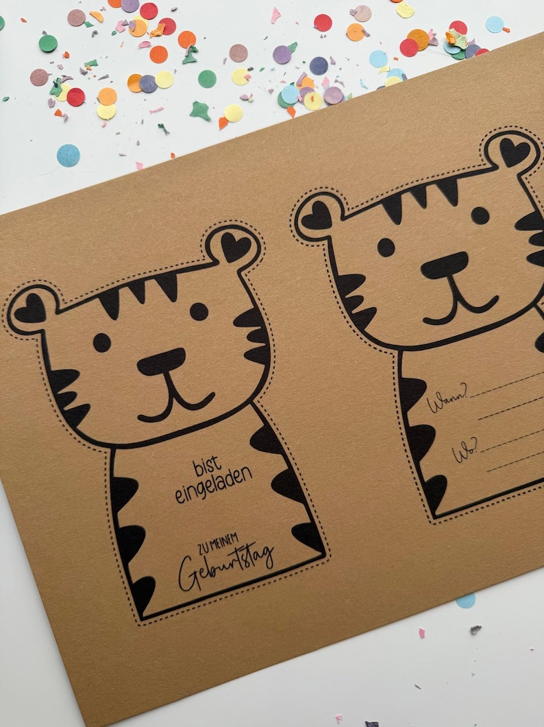 May include: Brown paper invitation with two cartoon tiger illustrations. The tigers have black stripes and heart-shaped ears. Text on the left reads "bist eingeladen ZU MEINEM Geburtstag". The right side has fill-in-the-blank lines for "Wann?" and "Wo?"