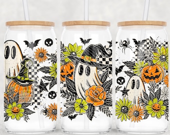 May include: Three glass tumblers with wooden lids and straws, featuring Halloween-themed designs. Each tumbler showcases a ghost wearing a witch hat, pumpkins, flowers, bats, spiders, and a checkered background. The designs are in orange, black, white, and green.