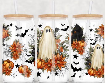 May include: Three glass tumblers with wooden lids and straws, decorated with Halloween-themed designs. Each tumbler features a different design: a ghost, a black cat, and pumpkins, surrounded by flowers, bats, and spiderwebs. The overall color scheme is white, orange, and black.