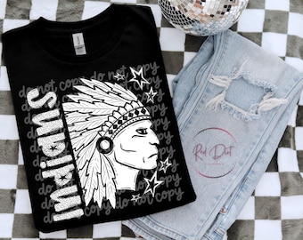 May include: Black t-shirt with a white graphic of a Native American chief in profile, the word "Indians" in a dotted font, and the text "do not copy". Light blue distressed jeans and a disco ball are also in the image.