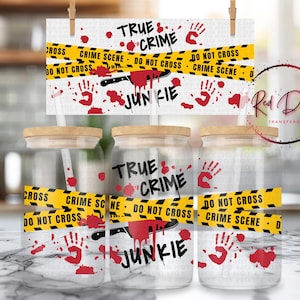 May include: Three clear glass jars with wooden lids and straws, decorated with a "True Crime Junkie" theme. The design includes red handprints, blood splatters, and yellow caution tape with "Crime Scene" text.