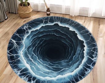 May include: A round, blue and white rug with a swirling, black hole design. The rug has a 3D effect, making it look like a hole in the ground.