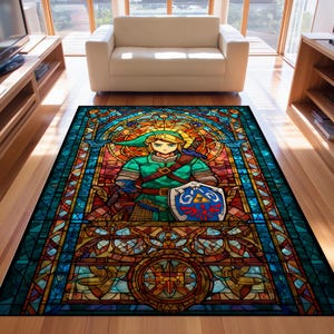 May include: A rectangular area rug featuring a stained-glass design with a central image of a character in green and blue attire, holding a shield. The rug has a vibrant color palette of blues, greens, oranges, and yellows, with a black border.