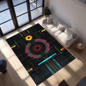 May include: A rectangular area rug featuring a black background with a complex digital interface design. The pattern includes concentric red and yellow circles, thin white grid lines, and geometric accents in cyan, yellow, and orange.
