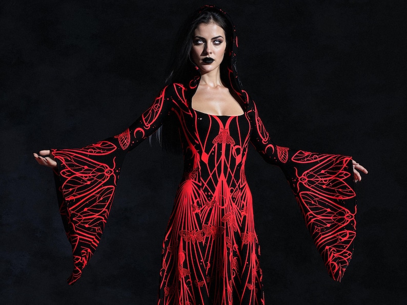 May include: A black and red hooded dress with a unique pattern. The dress features long, flared sleeves with a red insect-like design. The bodice and skirt also have a red, intricate pattern. The dress is worn against a dark background.