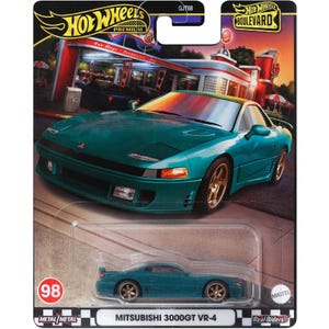 Puede incluir: Un modelo de coche de juguete de metal azul turquesa de un Mitsubishi 3000GT VR-4, parte de la serie Hot Wheels Premium Boulevard. El coche está sobre un fondo a cuadros blanco y negro con el número 98 y las palabras "Metal Metal" impresas en él. El coche también se muestra en un tamaño más grande en el embalaje, que presenta un logotipo de Hot Wheels rojo y blanco y las palabras "Hot Wheels Premium" y "Hot Wheels Boulevard".