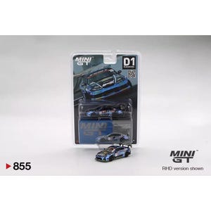 May include: A diecast model car in a blister pack. The car is a detailed replica with a blue and black color scheme. The packaging features the "MINI GT" logo and the number "855". The text "RHD version shown" is also visible.