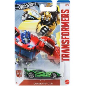 May include: A Hot Wheels die-cast toy car of a green Corvette C7.R, packaged with a Transformers theme. The card features Optimus Prime and Bumblebee, with the Transformers logo and the text "CORVETTE C7.R".