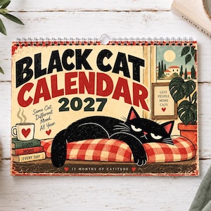 May include: A 2027 wall calendar titled Black Cat Calendar featuring a black cat lying on a red and white checkered pillow. The cover includes text reading Same Cat. Different Mood. All Year., Good Mood, Every Day, and Less People More Cats.