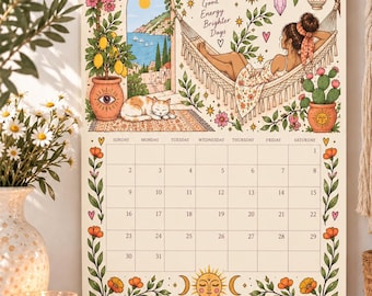 May include: A wall calendar for May 2027 featuring a colorful illustration of a person resting in a hammock, a sleeping cat, a lemon tree, and a coastal view. The calendar grid includes dates from the 1st to the 31st, decorated with floral borders and celestial sun and moon motifs.