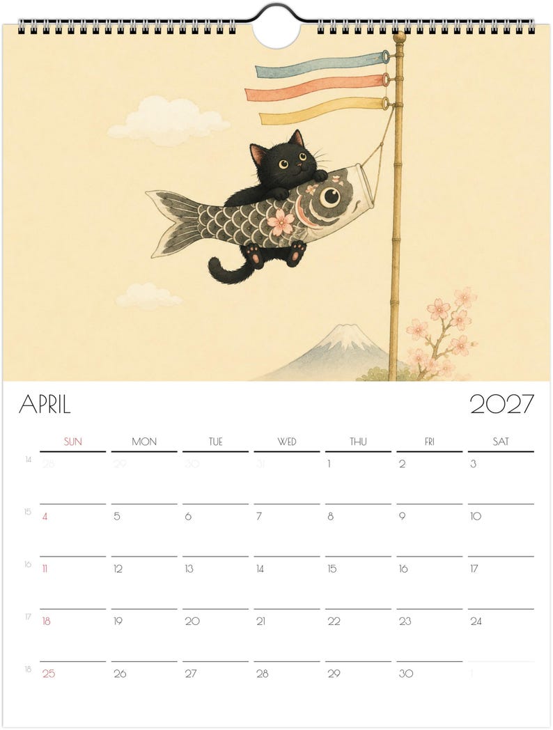 Puede incluir: Un calendario de pared para abril de 2027 con una ilustraci&oacute;n de un gato negro aferrado a una manga de viento de pez koi gris sujeta a un poste de bamb&uacute;. El fondo muestra un cielo amarillo p&aacute;lido, una monta&ntilde;a lejana y ramas de cerezo.