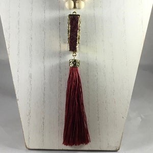 Wood beaded necklace with maroon stone and tassel