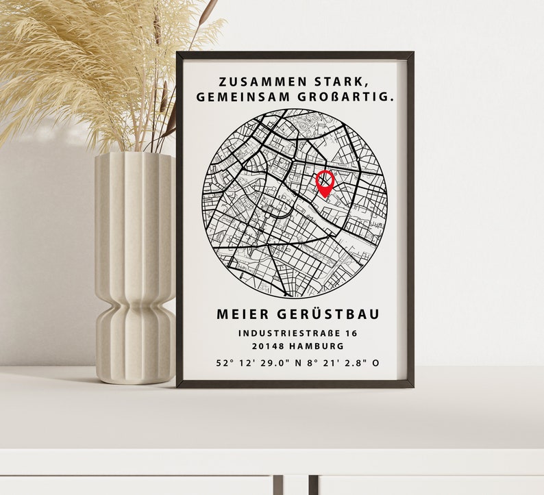 May include: Black and white map print with a red pin marking a location. The text reads "Zusammen Stark, Gemeinsam Grobartig."  "Meier Ger&uuml;stbau"  "Industriestra&szlig;e 16"  "20148 Hamburg"  "52&deg; 12' 29.0" N 8&deg; 21' 2.8" O"
