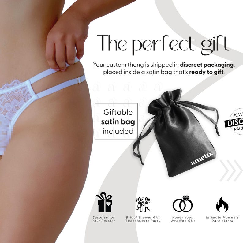 Pode incluir: Tanga de renda branca com uma bolsa de cetim preta. A imagem inclui o texto "O presente perfeito" e "Saco de cetim para presente inclu&iacute;do". A bolsa tem a marca "ameto". A imagem tamb&eacute;m inclui &iacute;cones para ideias de presentes.