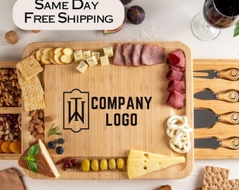 May include: Bamboo cheese board with a sliding drawer for storing cheese knives, crackers, and other snacks. The board features a personalized logo and is perfect for entertaining guests.