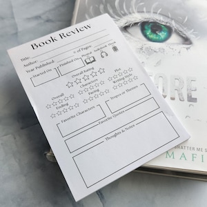 May include: A black and white book review template with a section for title, author, year published, number of pages, and overall rating. The template also includes sections for favorite characters, favorite quotes, and thoughts and notes.