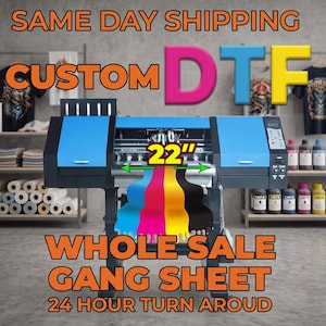 May include: A large industrial DTF printer with a blue and black frame, featuring a 22-inch wide printing area. Four streams of cyan, magenta, yellow, and black ink flow from the machine. Text on the image reads CUSTOM DTF, WHOLE SALE GANG SHEET.