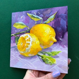 May include: Two yellow lemons with green leaves on a purple background. The lemons are painted in a realistic style with visible brushstrokes.